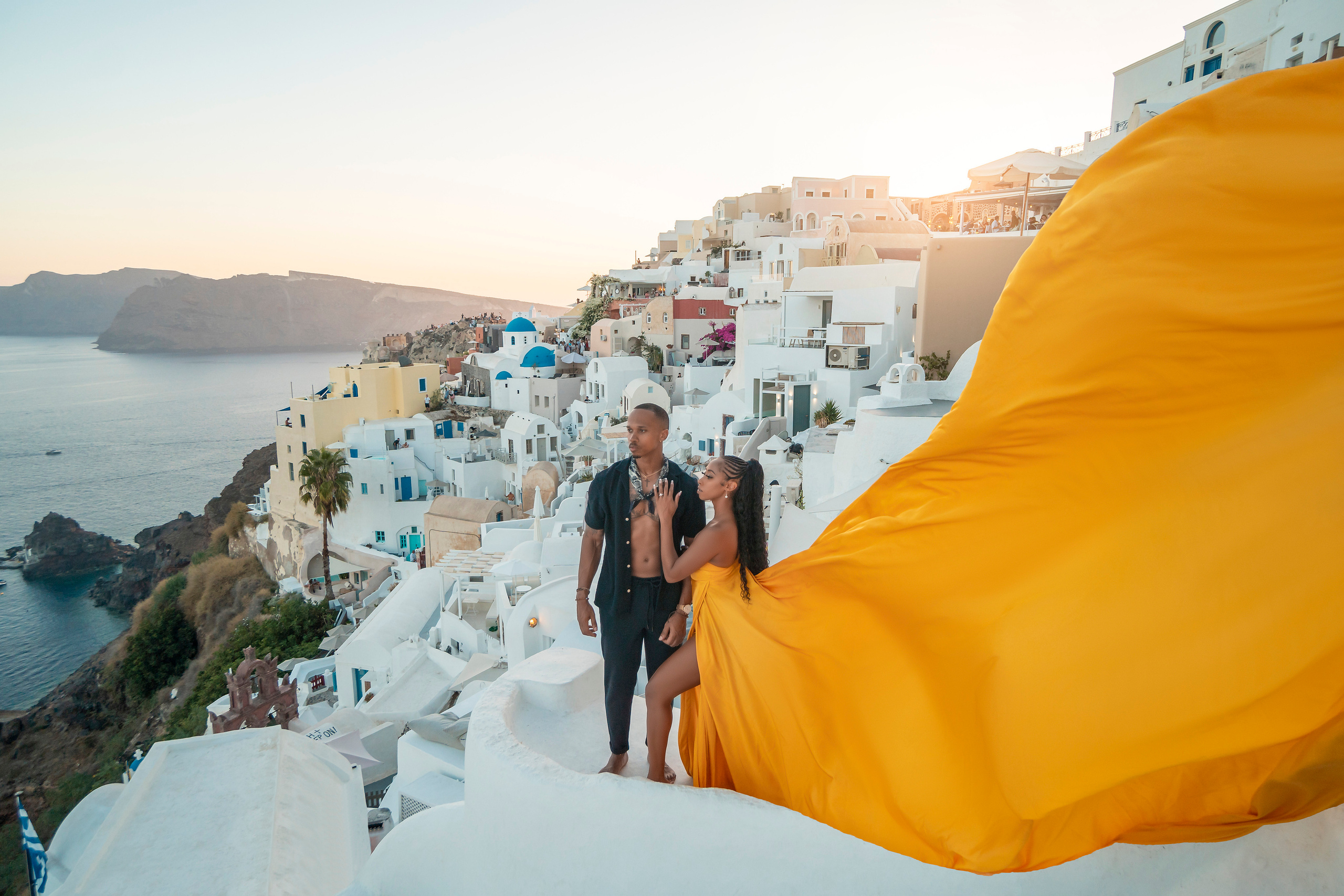 Romantic sunset view in Santorini with couple silhouette